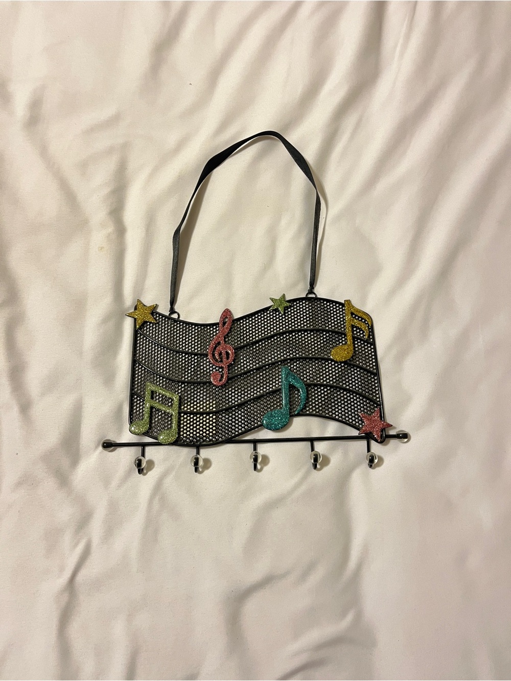 Claire's Black Musical Staff Wall Hook Rack with Colorful Glitter Notes